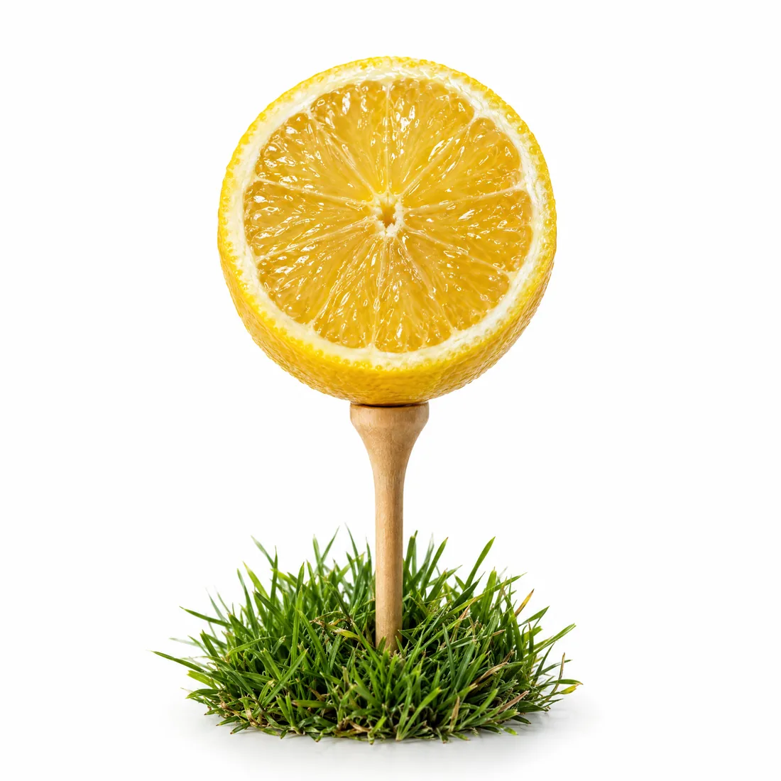 A halved lemon balanced on a golf tee